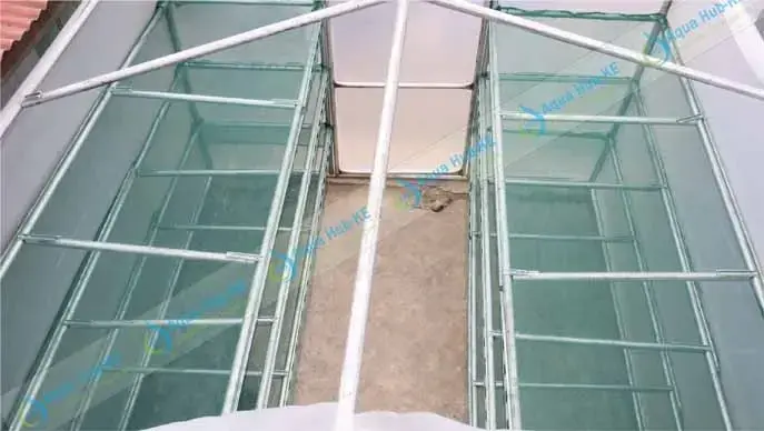 Drying racks inside a solar dehydrator by Aqua Hub Kenya